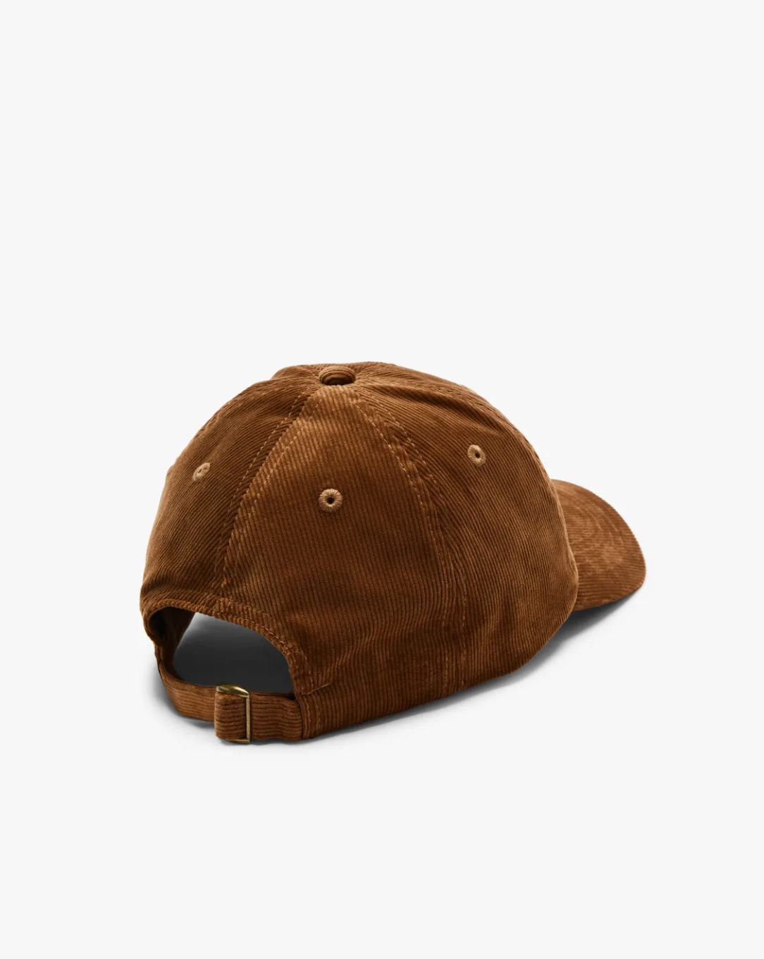 The RM Williams Corduroy Longhorn Cap, made from brown cotton corduroy, is shown from the back on a white background. It features an adjustable strap with a brass buckle, highlighting its subtle elegance.