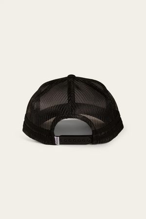 The Ringers Western Deacon Trucker Cap is displayed from the back, showcasing a black mesh design with a plastic snapback closure. A curved brim and side label enhance its style against a plain off-white background.