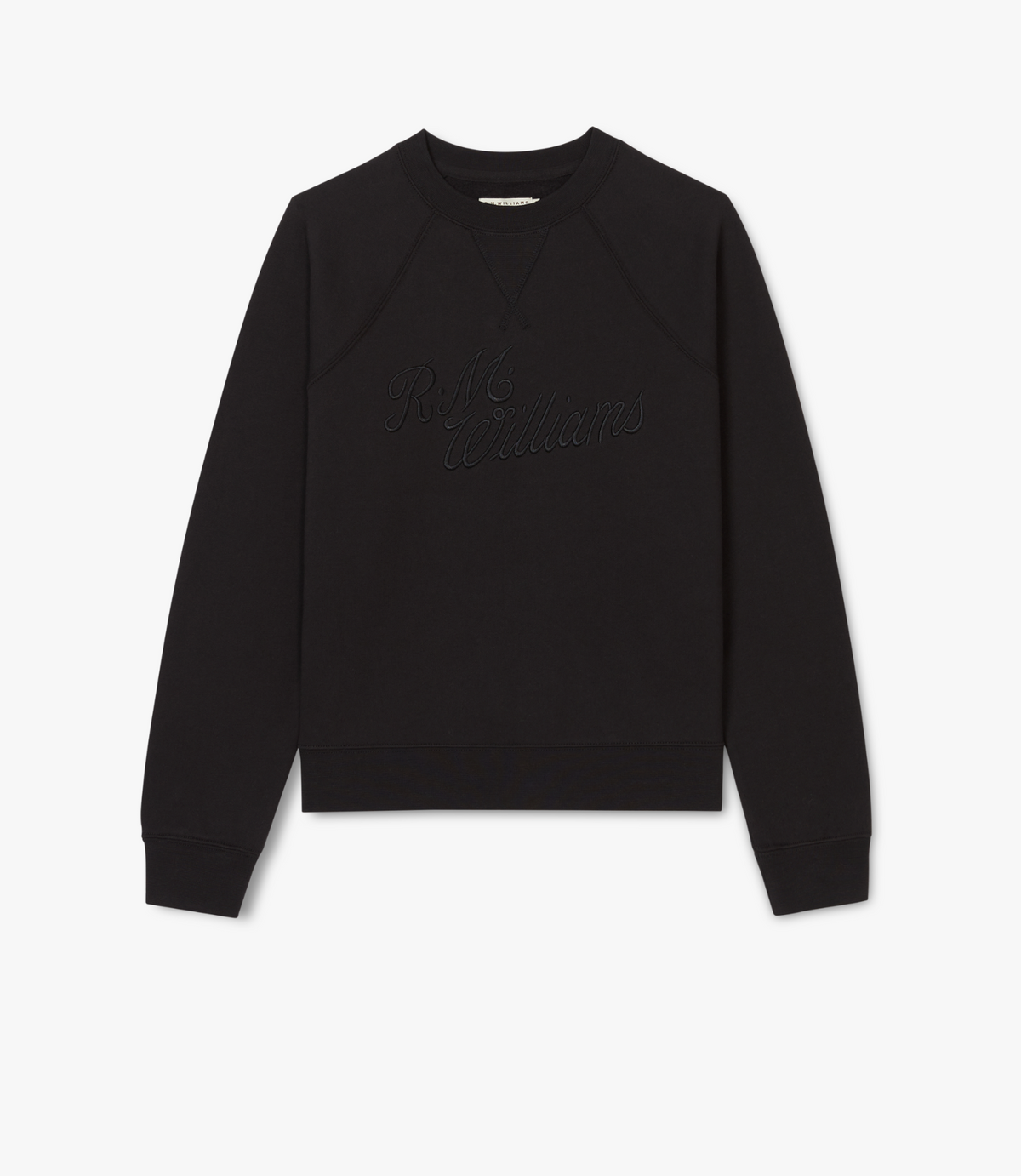 The RM Williams Womens Script Crew is a black cotton fleece sweatshirt with long sleeves and subtle cursive R.M.Williams embroidery on the front, reflecting classic Australian design, shown against a white background.