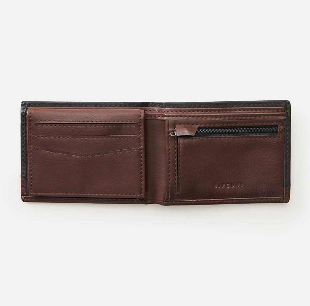 An open brown leather Rip Curl Ridge PU All Day Wallet is shown on a white background. It has card slots on the left, a zippered coin pocket on the right, and "RITUAL" embossed, blending elegance and functionality similar to the Rip Curl's PU All Day Wallet collection.
