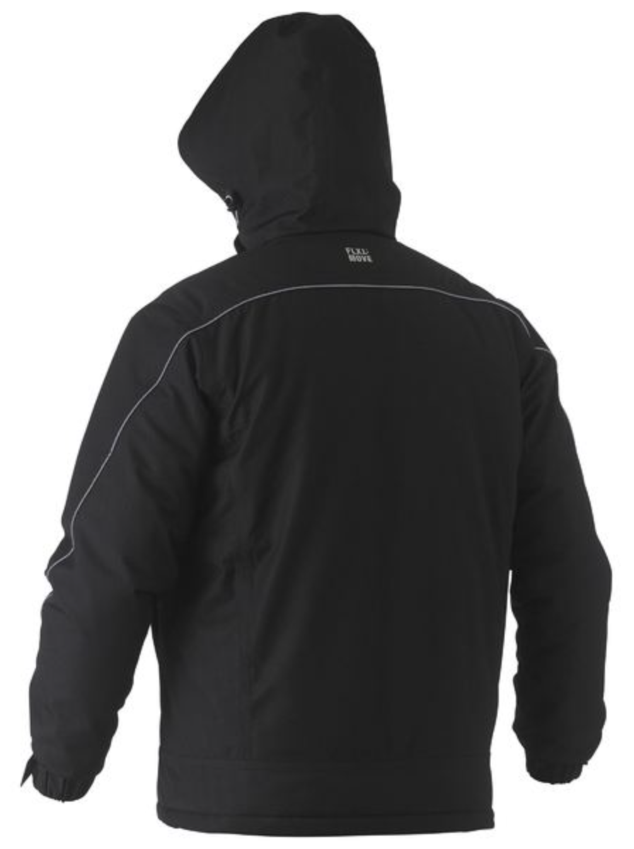 A person wearing a Bisley Heavy Duty Dobby Jacket, viewed from the back. This black waterproof jacket features light piping along the shoulders and arms, with a small white logo at the top center of the back.