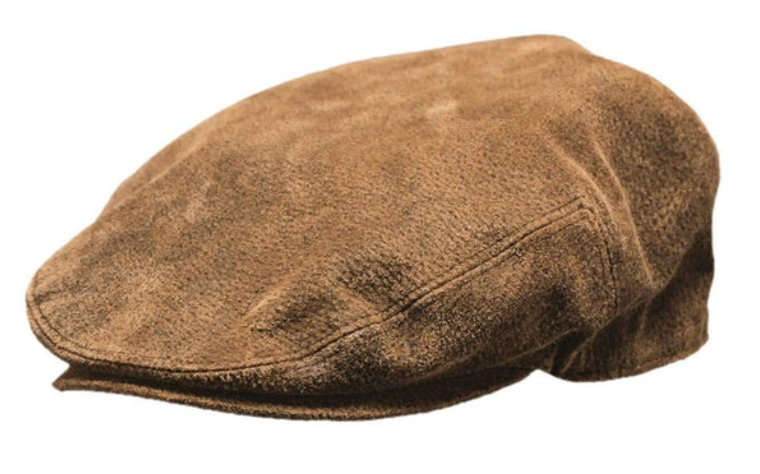 The Outback Leather Ascot Cap is a brown, textured leather cap with a classic design. It features subtle stitching, a rounded shape, and a short, stiff brim in true outback style. Made from 100% leather.