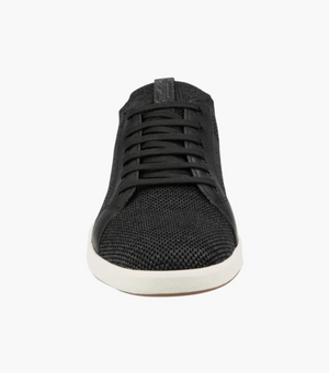 Front view of the Florsheim Crossover Knit, a black lace-up shoe featuring a textured fabric upper, cushioned footbed, and white rubber outsole, set against a white background.