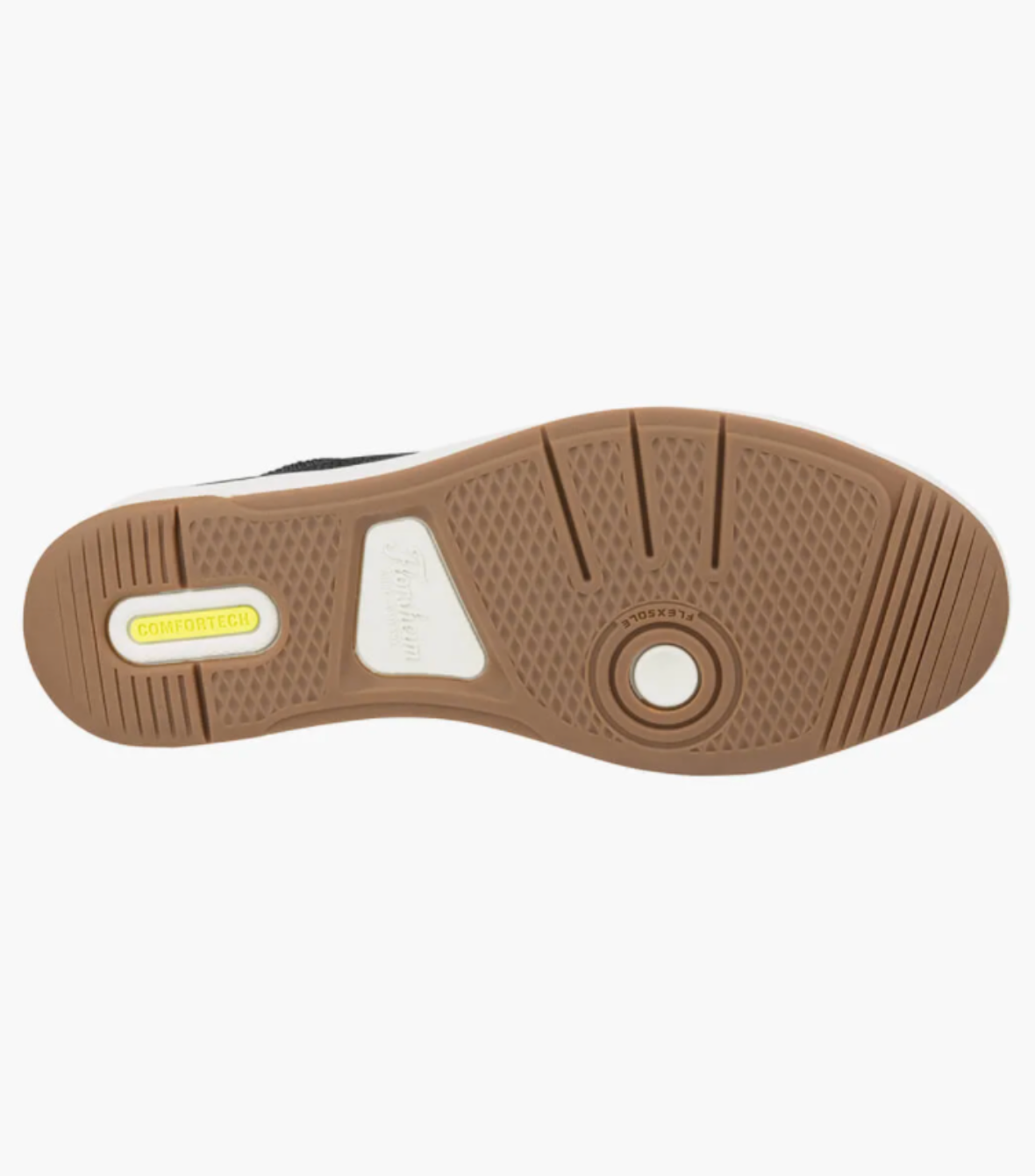The Florsheim Crossover Knit shoe has a brown rubber outsole with a textured grip pattern, a cushioned footbed, and a yellow "COMFORTECH" insert with the brand name on a white section in the center.