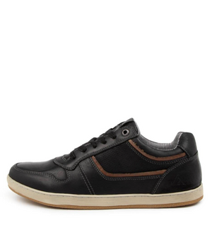 A side profile of the Colorado Eiko Leather Sneaker, featuring a black leather upper with brown accents, black laces, and stitching details. It has a cream sole and durable rubber grip outsole, displayed on a white background.
