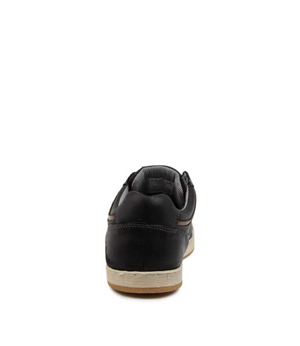 The Colorado Eiko Leather Sneaker in black leather features a white rubber outsole, shown from the back against a white background.