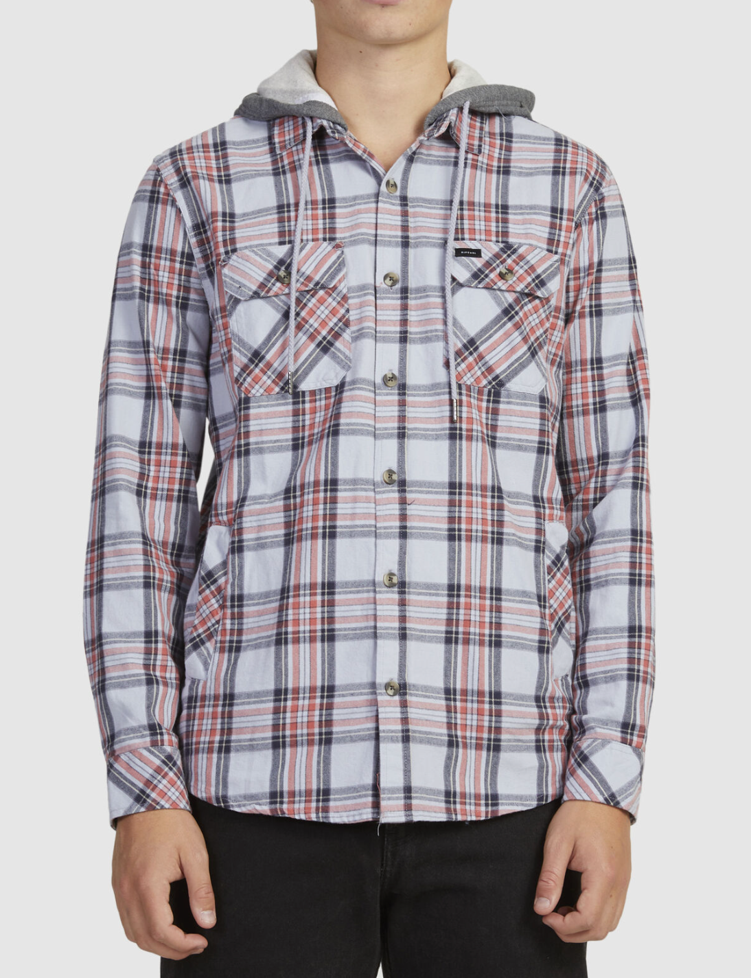 A person wears the Rip Curl Ranchero Flannel Shirt, featuring a white, gray, and red plaid pattern with two chest pockets and a hood, standing against a plain light background.