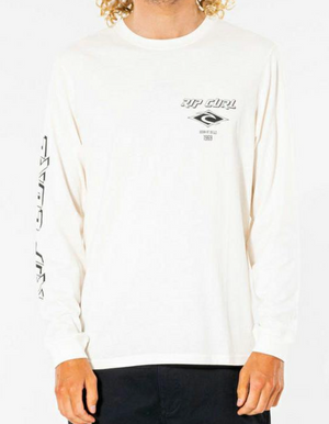Wearing the white Rip Curl Fade Out Icon Long Sleeve Tee, made from organic cotton with "Rip Curl" text and a 1969 logo on the chest and sleeve, paired with dark pants against a plain white background creates a classic casual look.