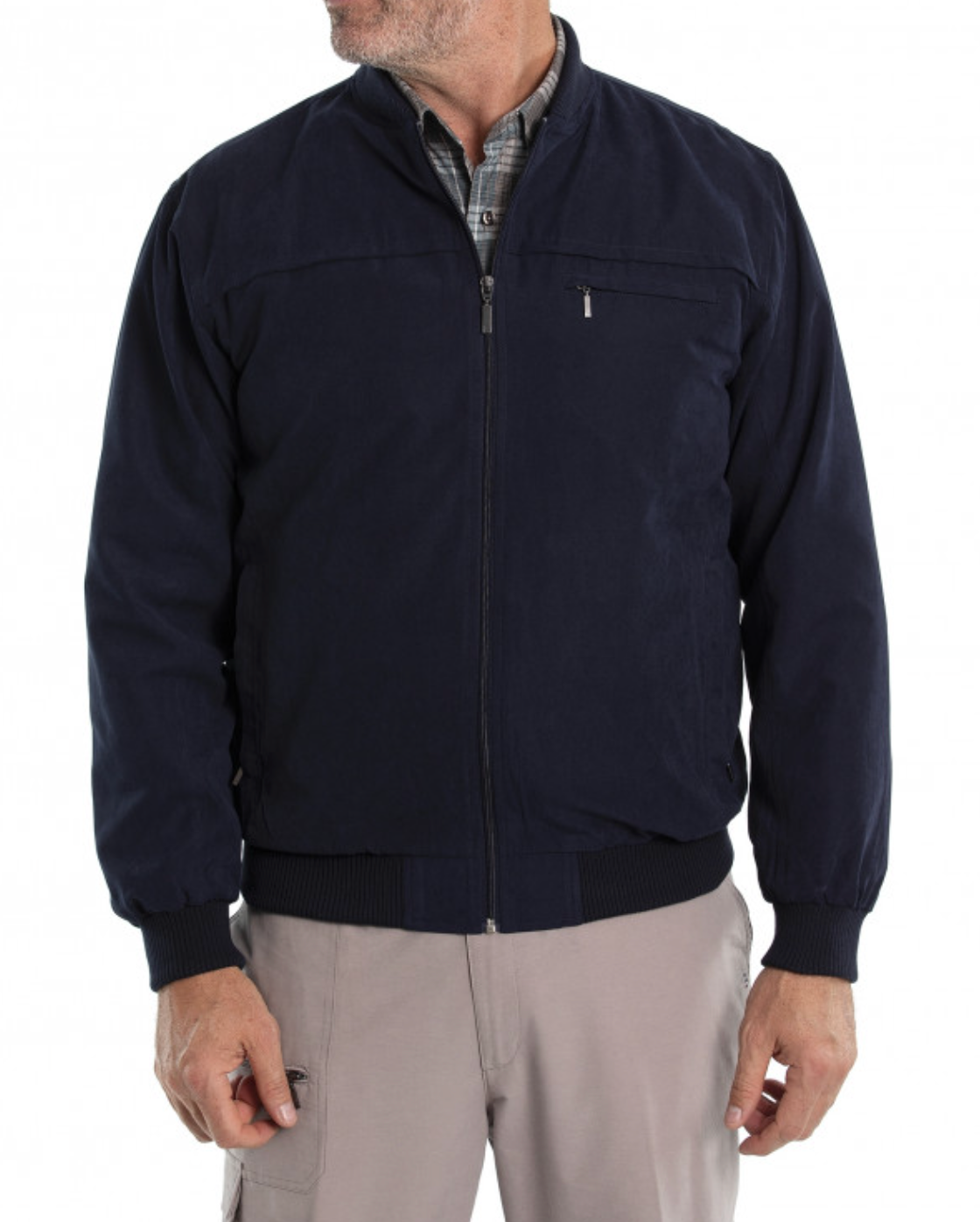 A person is styled in the Breakaway Microfibre Bomber Jacket, navy blue with a rib knit collar and full zip front, over a plaid shirt. It has side pockets and pairs well with beige pants. The person's face is unseen in the image.