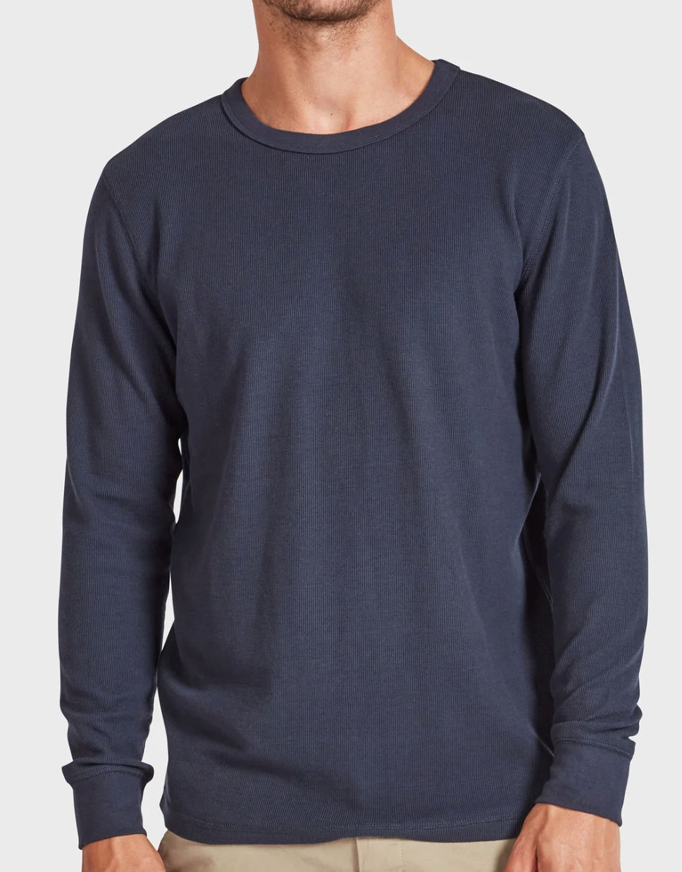 Against a plain white background, a person is shown from shoulders to hips wearing the Academy Brand Workers Crew, a dark blue long-sleeve shirt with a classic crew neck and comfortable standard fit.