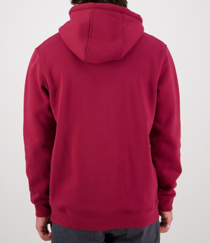 The image shows a person wearing the Swanndri Original Fleece Hoody in maroon, creating a casual vibe with the hood down as they face away from the camera. The long sleeves hang by their sides, perfectly matching their dark pants for an effortlessly relaxed look.