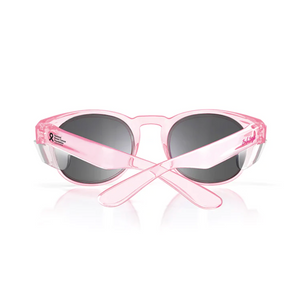 The SafeStyle Cruisers Pink Frame Tinted Lens sunglasses feature crossed arms displaying a breast cancer awareness ribbon and text. With polarised, UV-protection black lenses and excellent safety ratings, these stylish shades ensure clear vision and reliable sun protection.