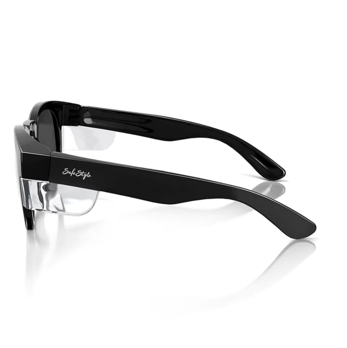 The SafeStyle Cruisers feature black thick frames with clear side lens blocks, polarised lenses for UV protection, and the signature "StyleEyes" on the temple. The slightly curved arms enhance their sleek, modern design.