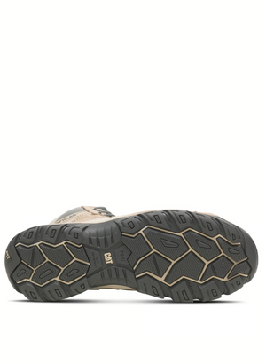 The image showcases the sole of the CAT Argon Hi Side Zip Work Boot, featuring a beige hiking boot design with a black rubber tread. The complex pattern enhances grip for slip resistance, making it ideal for outdoor activities on rough terrain and highlighting its rugged reliability.