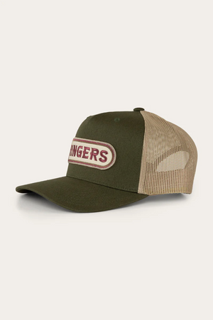The Ringers Western Jaxton Trucker Cap in olive green and tan features a curved brim with a "DINGERS" patch on the front. Made from durable cotton twill, it has a breathable tan mesh back, embodying rugged style.
