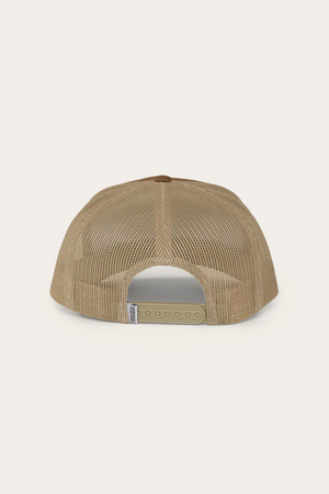 The Ringers Western Jaxton Trucker Cap is a tan mesh baseball cap featuring a brown top button, adjustable tan strap closure with multiple sizing holes, and made from Cotton Twill.