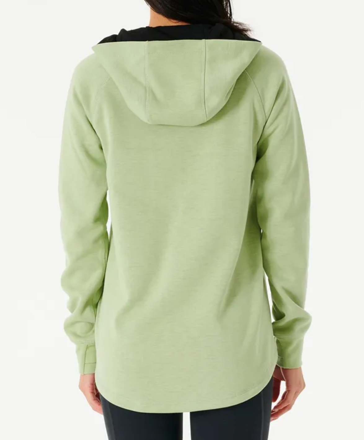 Rear view of a person wearing a Rip Curl Anti Series Flux II Zip light green hoodie, paired with durable water-resistant black pants, set against a plain white background.