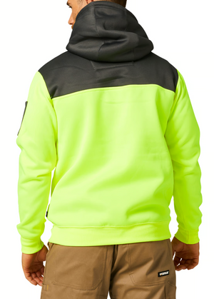 A person is dressed in a neon yellow and black CAT Hi Vis Hoodie with the hood up, facing away from the camera. They are also wearing light brown pants featuring visible stitch detailing, exuding rugged dependability.