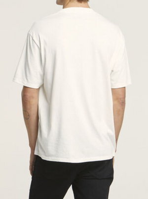 A person in a plain white Wrangler Border Tee and black pants stands facing away, showcasing the back of the regular fit, 100% cotton T-shirt against a light gray background.