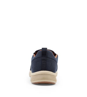 A single Colorado Saka Casual Shoe in dark navy blue with a beige sole, viewed from the back. The shoe features a pull tab at the heel, arch support, and a textured pattern on the sole for grip. Its interior lining appears to be light brown or tan. The background is plain white.