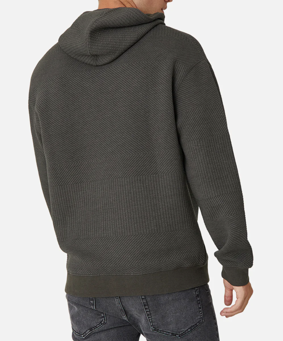 A person is seen from behind wearing the Industrie The Robinson Hoodie in dark gray with a textured herringbone pattern and relaxed fit, paired with slightly faded jeans. They stand against a white background.