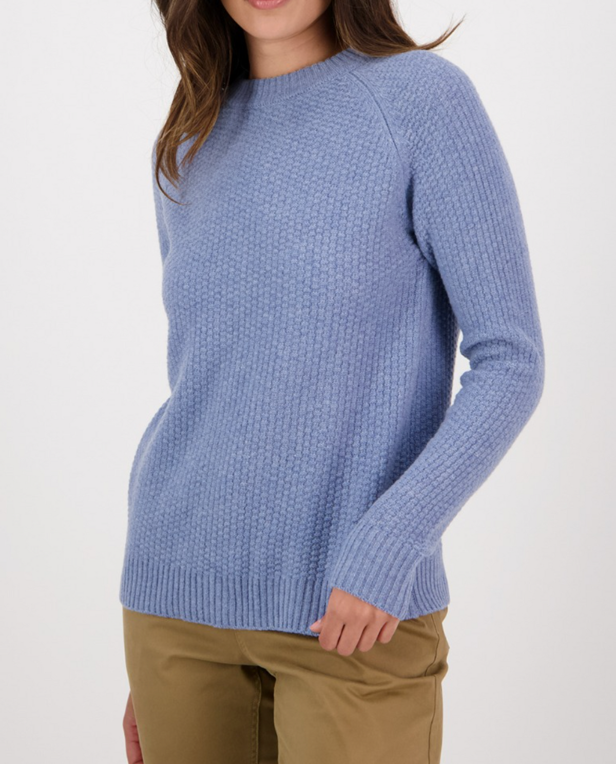 A person wearing the Swanndri Hayes Park Waffle Knit Crew in light blue and beige pants is standing against a plain white background. The image is cropped from the shoulders down, making the person's face not visible.