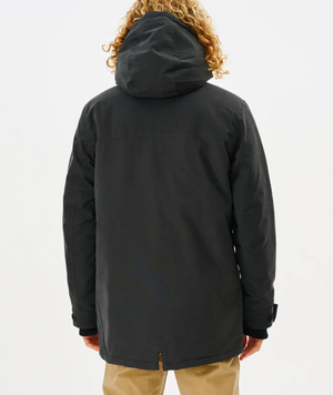 Seen from behind, a person with curly hair wears the Rip Curl Anti Series Exit Jacket featuring Durable Water Resistant technology and khaki pants, perfect for winter. They stand against a plain white background.