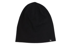 The Rip Curl T-Street Skull Beanie, a sleek black hat featuring a roll cuff and a subtle logo tag on the edge, is showcased against a pristine white background.