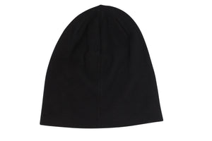 The Rip Curl T-Street Skull Beanie, plain and black with a smooth texture, showcases a subtle roll cuff. Displayed on a white background, it offers effortless style without visible logos or patterns.
