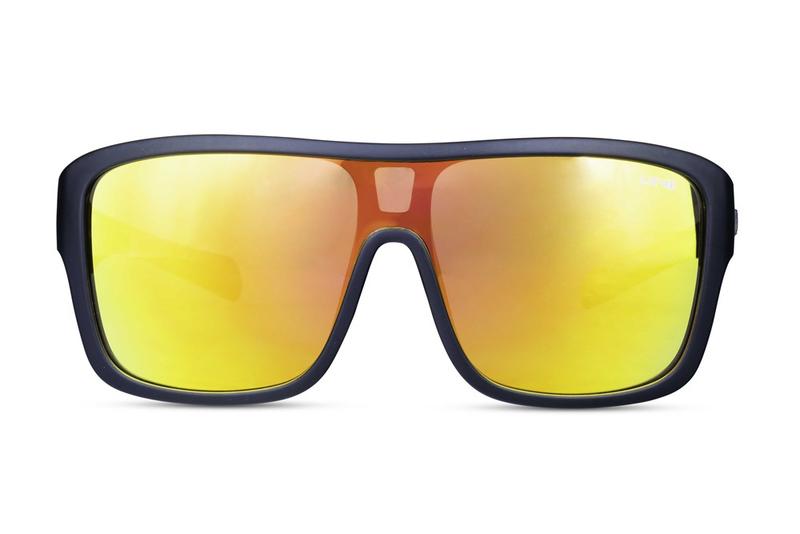 Liive Verdict Mirror Sunglasses featuring a wide black frame and large, reflective yellow UV-protective lenses, displayed front-facing on a white background.