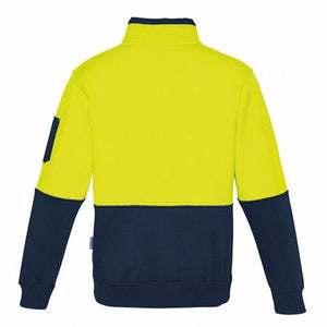 The Syzmik Hi Vis Half Zip Pullover features a bright yellow upper section and a dark navy blue lower section and sleeves. This comfortable pullover includes a stand-up collar, a left arm patch pocket, and ribbed cuffs at the wrists and waistband. The jacket is displayed from the back.