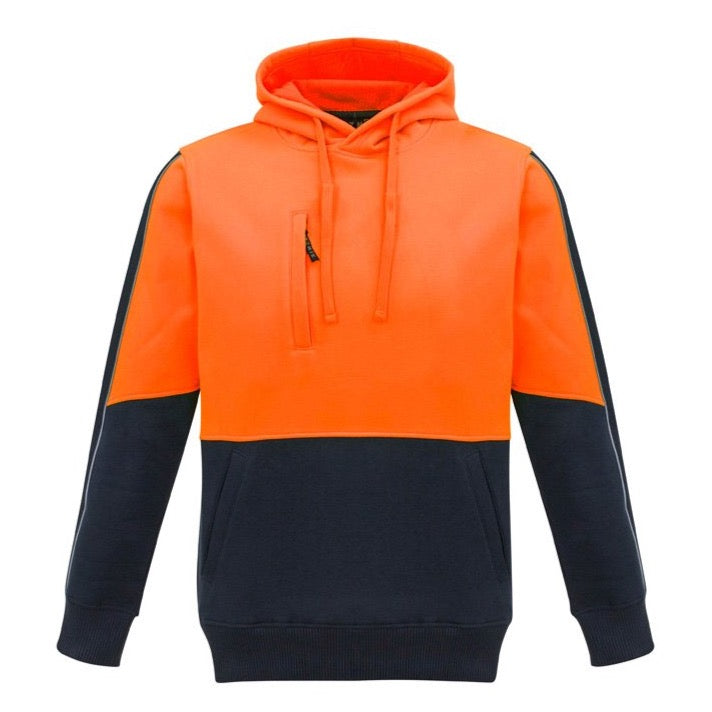 The Syzmik Pullover Hoodie is a color-block design made from polyester fleece, featuring a vibrant orange top half, including the hood and sleeves, and a navy blue bottom half. It includes practical details such as a front pocket, a chest pocket with a zipper, and drawstrings for the hood.