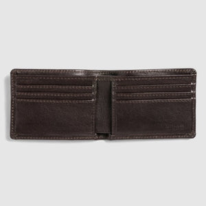 The Rodd & Gunn Victoria Flats Road Wallet is an open, brown leather bifold featuring multiple card slots on both sides and a spacious bill compartment in the middle, crafted from Genuine Buffalo Leather and displayed against a plain white background.