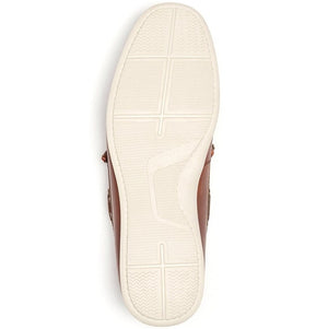 The image displays the underside of a single Rodd & Gunn Gordons Bay Boat Shoe in brown, featuring a white rubber outsole. This sole showcases various textured patterns such as zigzags and intersecting lines to enhance grip. The heel and toe areas exhibit distinct designs, suggesting added support and flexibility.