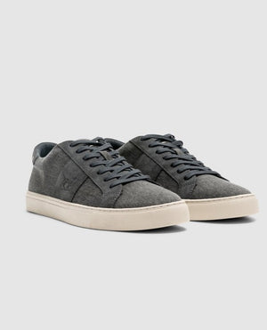 A pair of Rodd & Gunn Endeavour Sail Sneakers in gray suede with white rubber soles. Enhanced with suede leather trims, these shoes feature matching gray laces and a subtle embossed logo on the side. They boast a moulded footbed for extra comfort and are photographed against a plain light gray background.