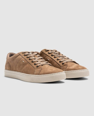 The Rodd & Gunn Endeavour Spirit Sneaker features tan nubuck leather, sleek white rubber soles, and matching laces. Displayed on a grey background, these casual low-top sneakers are ideal for everyday wear.