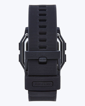 Close-up of the black Rip Curl Atom Digital Watch’s ribbed waterproof strap and buckle, viewed from the back. The Rip Curl logo is visible on both the buckle and strap loop.
