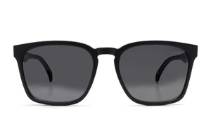 The Liive Alik Sunglasses feature black square frames and dark tinted, optically correct lenses with UV protection, displayed frontally on a white background.