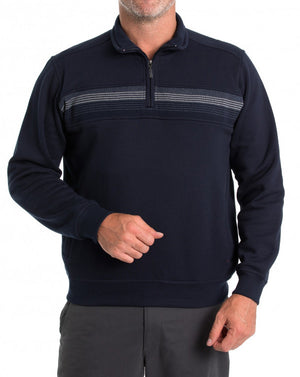 A person wearing a navy blue Breakaway Leo Snowy Mt Fleece Half Zip with a horizontal stripe design across the chest, standing with their right hand partially formed into a fist. The pullover, a true winter staple, is paired with dark gray pants against a plain white background.