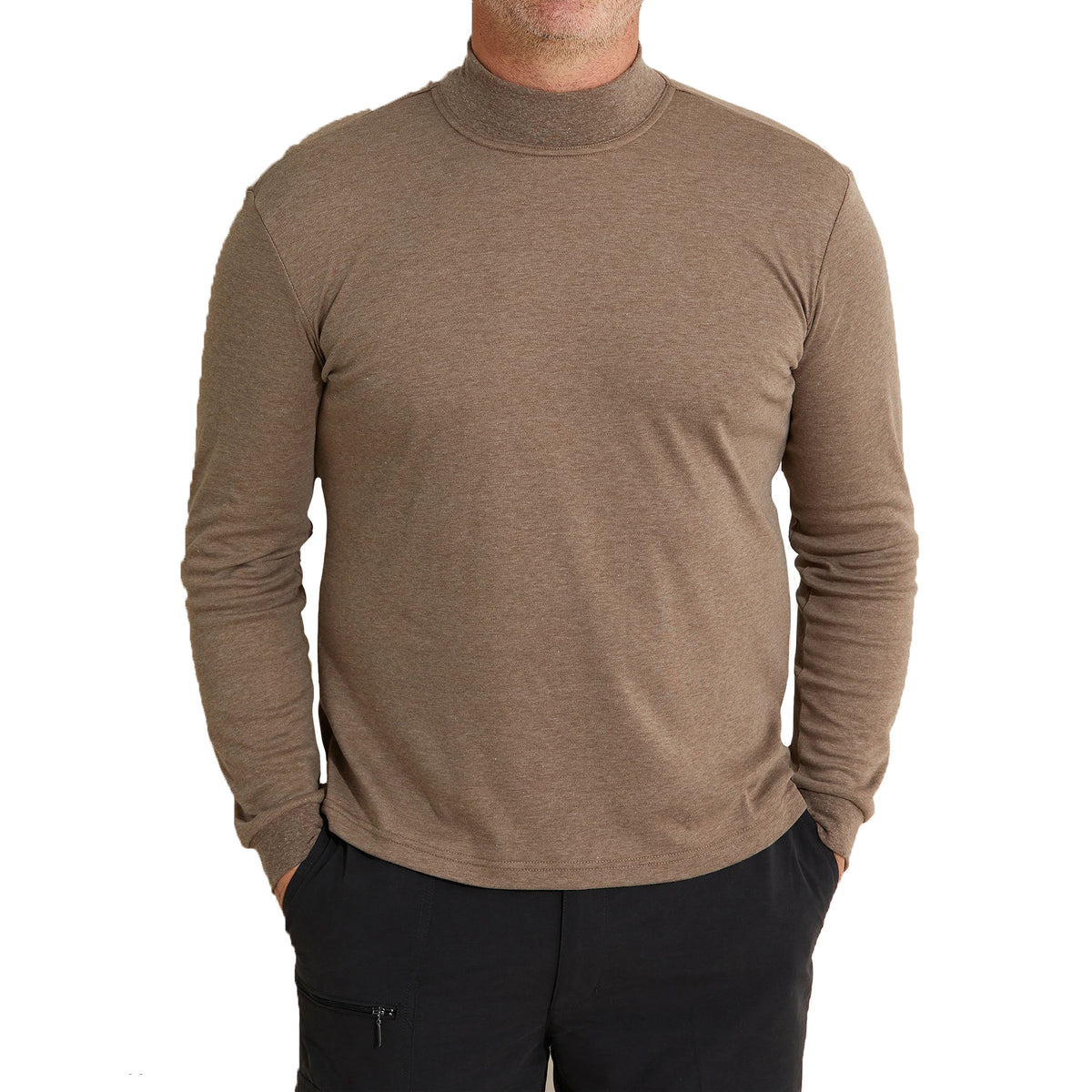 Wearing a Breakaway Skivvy, featuring a plain brown turtleneck long-sleeve shirt in a cozy polyester-cotton blend, paired with black pants, the person stands against a white background. The unseen head makes this ensemble an ideal example of versatile winter wear.