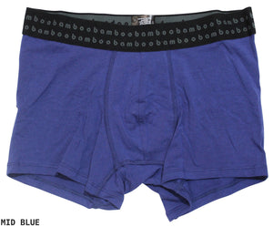 These men's Bamboo Trunks in mid-blue are designed for optimal comfort and feature anti-bacterial properties. The black waistband is adorned with "bambo" repeatedly printed in light blue, while the soft and stretchy fabric ensures a perfect fit. "MID BLUE" is subtly written in black on the bottom left corner.