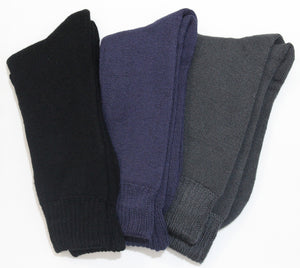 Three pairs of the Bamboo 3 Yarn 3 Pack Work Socks are laid flat next to each other. From left to right, the socks are black, navy blue, and dark gray. Made from an anti-bacterial fabric, these socks have a simple knit pattern and are folded at the cuffs. The background is a plain white surface.