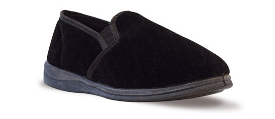 The Twin Gusset Slipper is a black slip-on shoe with a low-profile design, featuring a soft fabric exterior, elastic side panels, and a cushioned memory foam sole. Its simple and comfortable look, along with anti-bacterial linings, makes it ideal for casual or indoor wear.