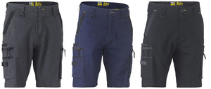 Three pairs of Bisley Flex & Move Stretch Utility Cargo Shorts displayed in a row. Each pair features multiple pockets, belt loops, and zippered pockets. The colors are dark gray, navy blue, and black. They have reinforced stitching and a rugged design suitable for heavy-duty use with reinforced belt loops for added durability.