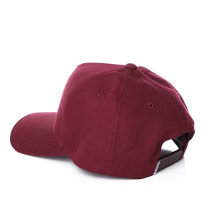 A plain, deep red Ringers Western Grover Baseball Cap is shown from the back. The cap features an adjustable strap with a series of small holes for sizing and a slightly curved bill. The material appears soft and slightly textured.