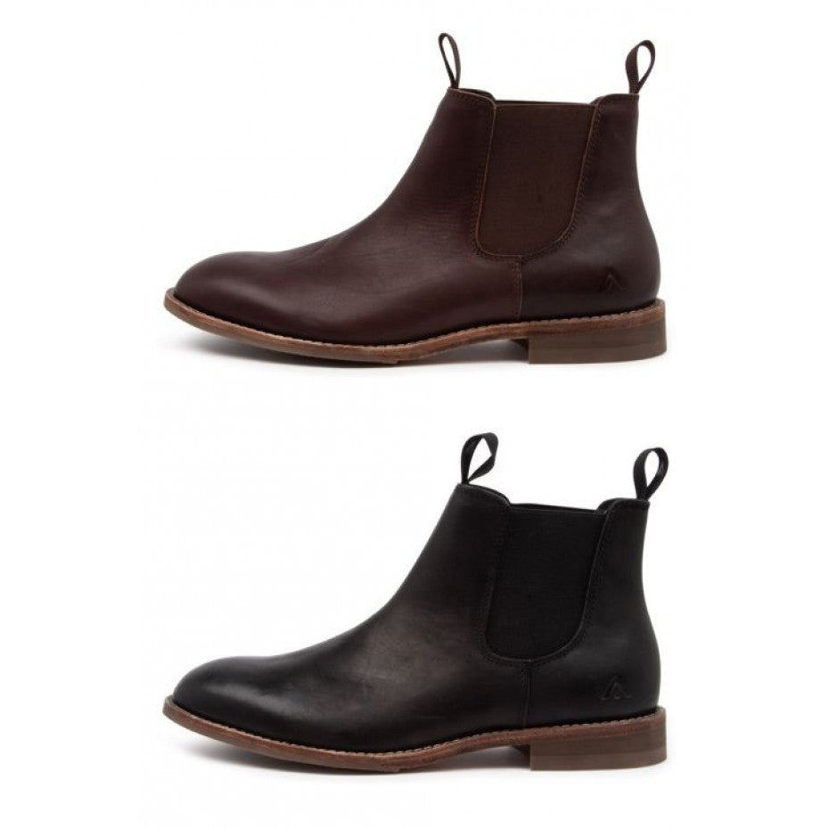 Two pairs of Chelsea boots are shown: the top pair features dark brown leather, and the bottom pair is in black leather. Both pairs boast elastic sides, pull tabs at the front and back, and a low wooden heel reminiscent of the Colorado Brumby Boot design.