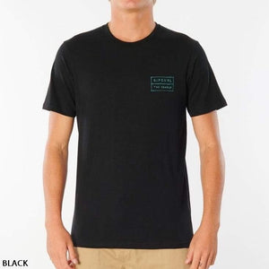 A person is wearing a Rip Curl 50/50 Scratch Tee, a plain black, 100% cotton shirt with short sleeves. This comfortable tee features a small green logo on the left chest with the text "RIP CURL" and "THE SEARCH." The background is plain white, and the word "BLACK" is written in the bottom left corner.