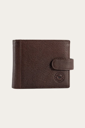 The Ringers Western Cypress Wallet, made from genuine leather with a textured surface, has a snap closure and features a circular embossed logo in the lower right corner, pictured against a plain background.