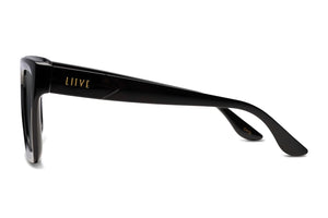 Side view of Liive Desire Sunglasses in black, showcasing "LIIVE" in gold on the temple. Featuring a durable, glossy polycarbonate frame with a rectangular design for both style and UV protection.