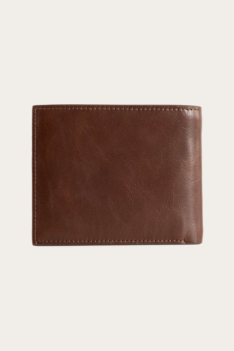 A closed Ringers Western Duke Wallet in brown genuine leather is centered on a light gray background. The smooth texture and visible stitching showcase the brand's commitment to craftsmanship and durability.